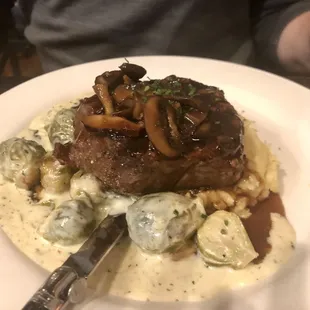 Ribeye. Cooked to correct temperature. The veggies were a bit too heavy with the cream as you can see