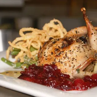 cornish game hen stuffed with fig dressing with cranberry sauce and our own take on green bean casserole.