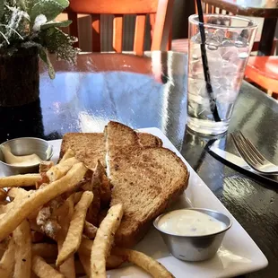 Grilled cheese stuffed with grilled onions and interesting cheese...but it was between dry bread and accompanied by limp, flavorless fries.