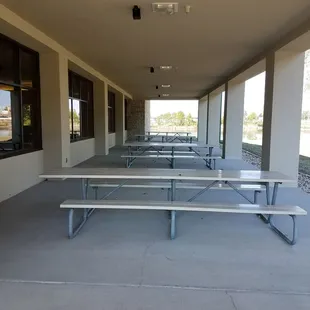 Patio with picnic tables wraps around venue