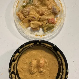 Clear dish is all the onions and bell peppers. Black dish is the chuncky sauce and 3 pieces of chicken