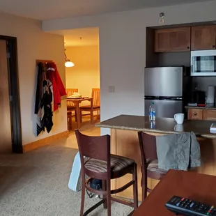 View across kitchen bar to dining room beyond