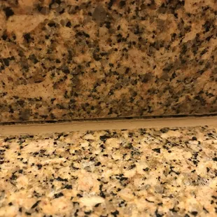 Grout on bathroom counter is separating. Might not seem like a big deal now, but just think of all the moisture getting in there.