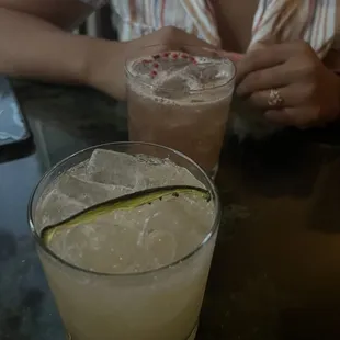 two cocktails on a table