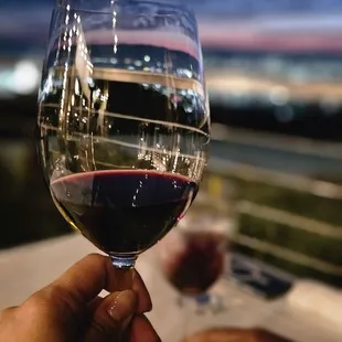 Grandview cabernet sauvignon with the south baby&apos;s lights reflected onto the wine glass