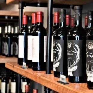 a shelf of wine bottles