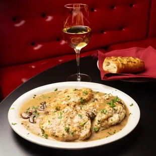 a plate of chicken with mushroom gravy