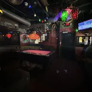 a pool table in the middle of the room