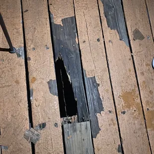 a hole in the wood floor