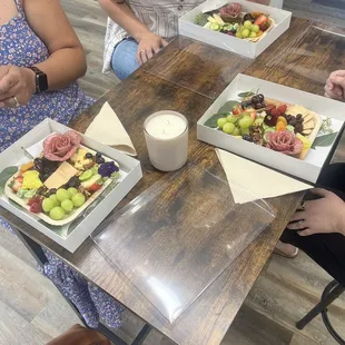 Workshop attendees making their own charcuterie board