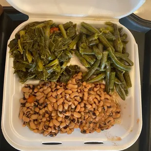 a container of beans and greens