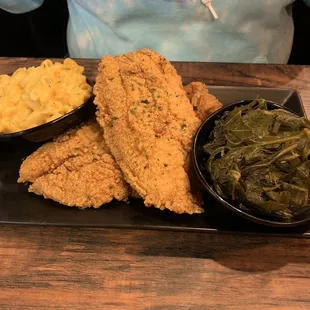 Fried catfish plate with macaroni and cheese and collard greens