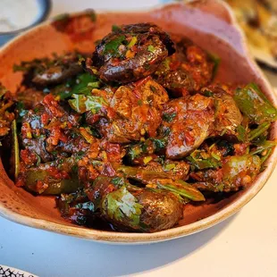 Batata harra, pretty good. I do wish they salted the potatoes a bit and served them crispy.