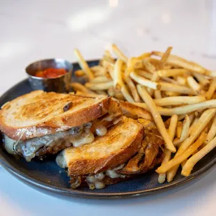 a grilled cheese sandwich and french fries