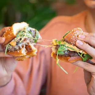a woman eating a hamburger