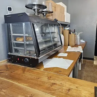 a bakery counter with bread in the oven