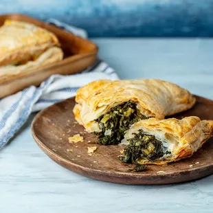 a plate of spinach and cheese pastries