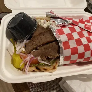 a sandwich in a styrofoam container