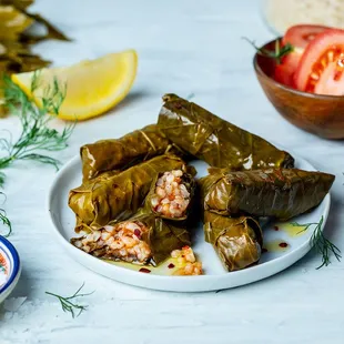 a plate of stuffed grape leaves