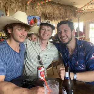 three men posing for a picture