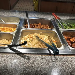 a variety of food in a buffet