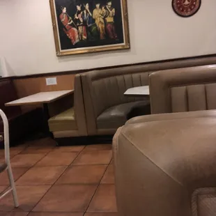 a restaurant with booths and tables