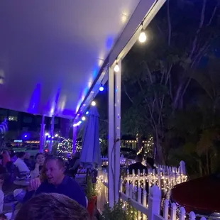 a man sitting at an outdoor restaurant