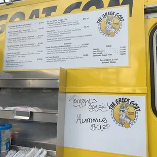 a food truck with a menu on the side