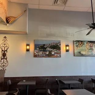 a dining area with tables and chairs