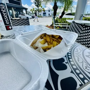 french fries in a styrofoam container