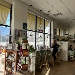 a woman sitting at a table in a cafe
