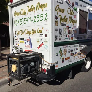 a delivery truck parked on the side of the road