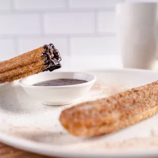 two churros on a plate