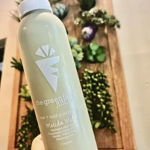 a hand holding a bottle