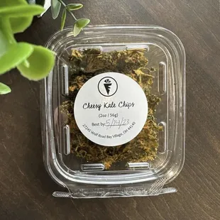 a container of dried kale chips