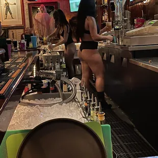 a woman sitting at the bar