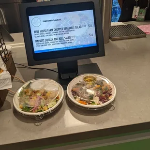 two bowls of food on a counter