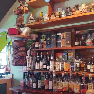 a shelf full of liquor