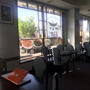 a dining room with tables and chairs