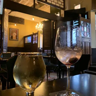 two glasses of wine on a table