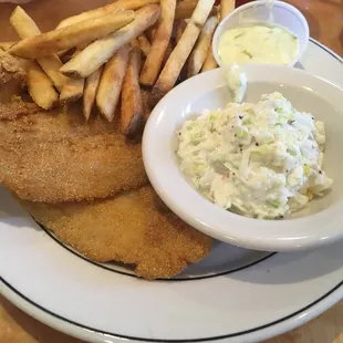a plate of fish and chips and coleslaw