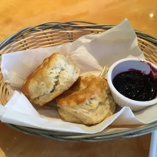 a basket of biscuits and jam