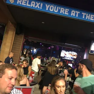 a group of people at a bar