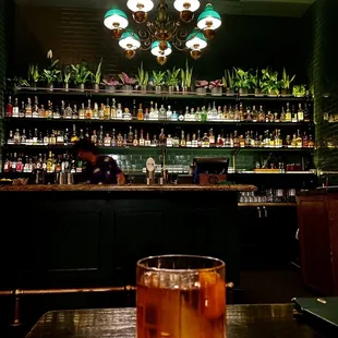 a bar with a glass of drink