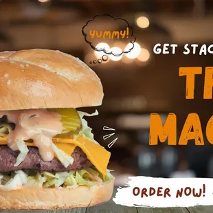 a hamburger with cheese and lettuce