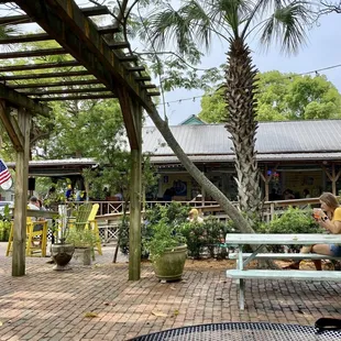 a woman sitting at a picnic table