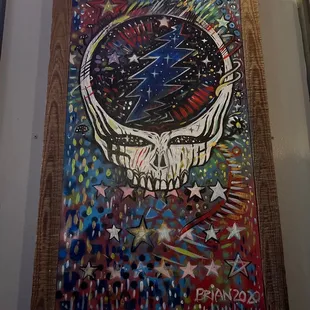a painting of a skull and stars