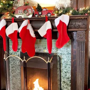a fireplace with stockings hanging from it