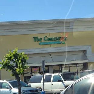 cars parked in front of the store