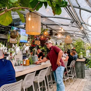 a man standing at the bar